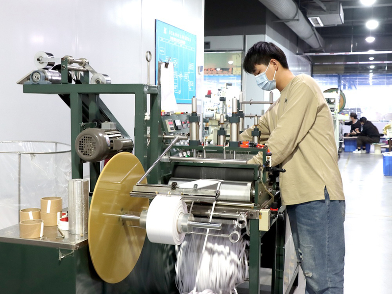 Adhesive slitting machine