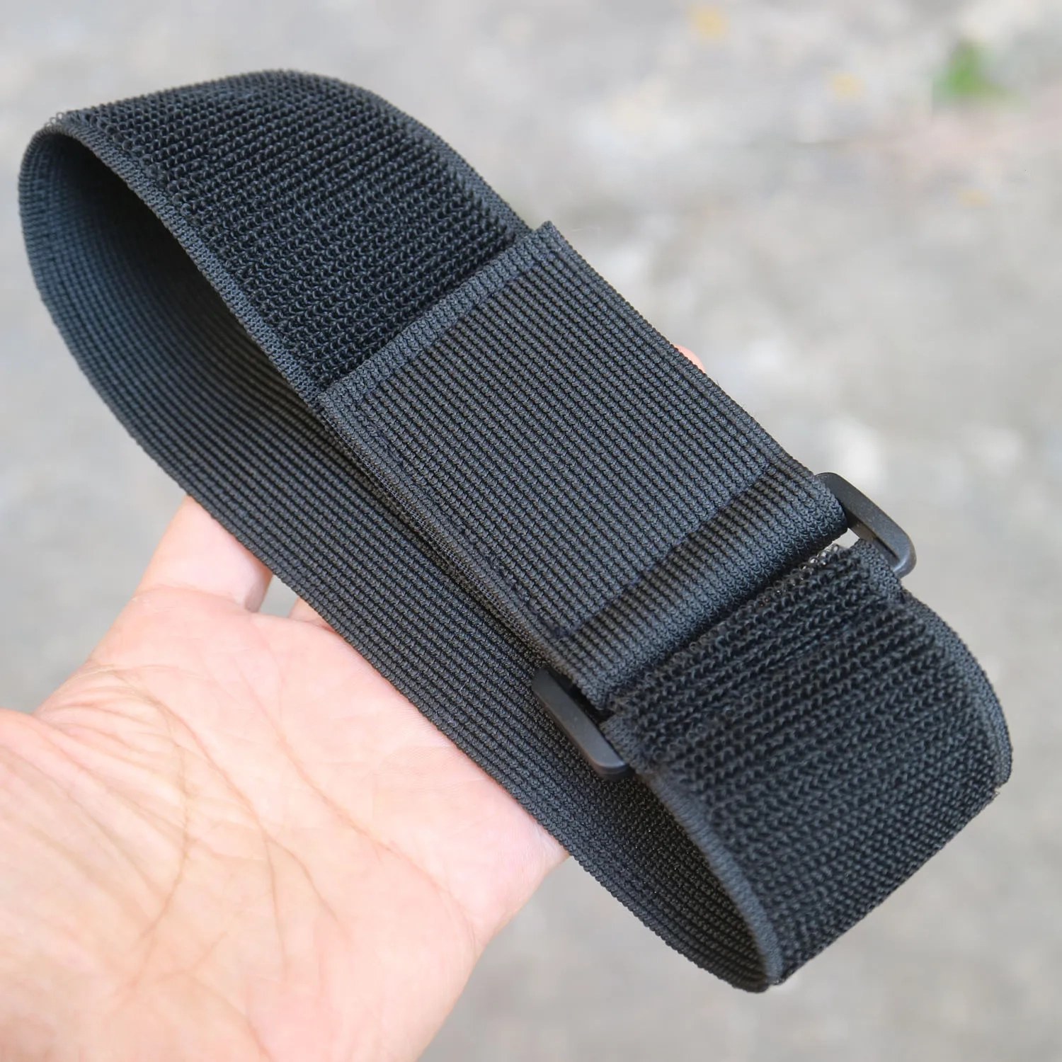 Black hook and loop fastening strap