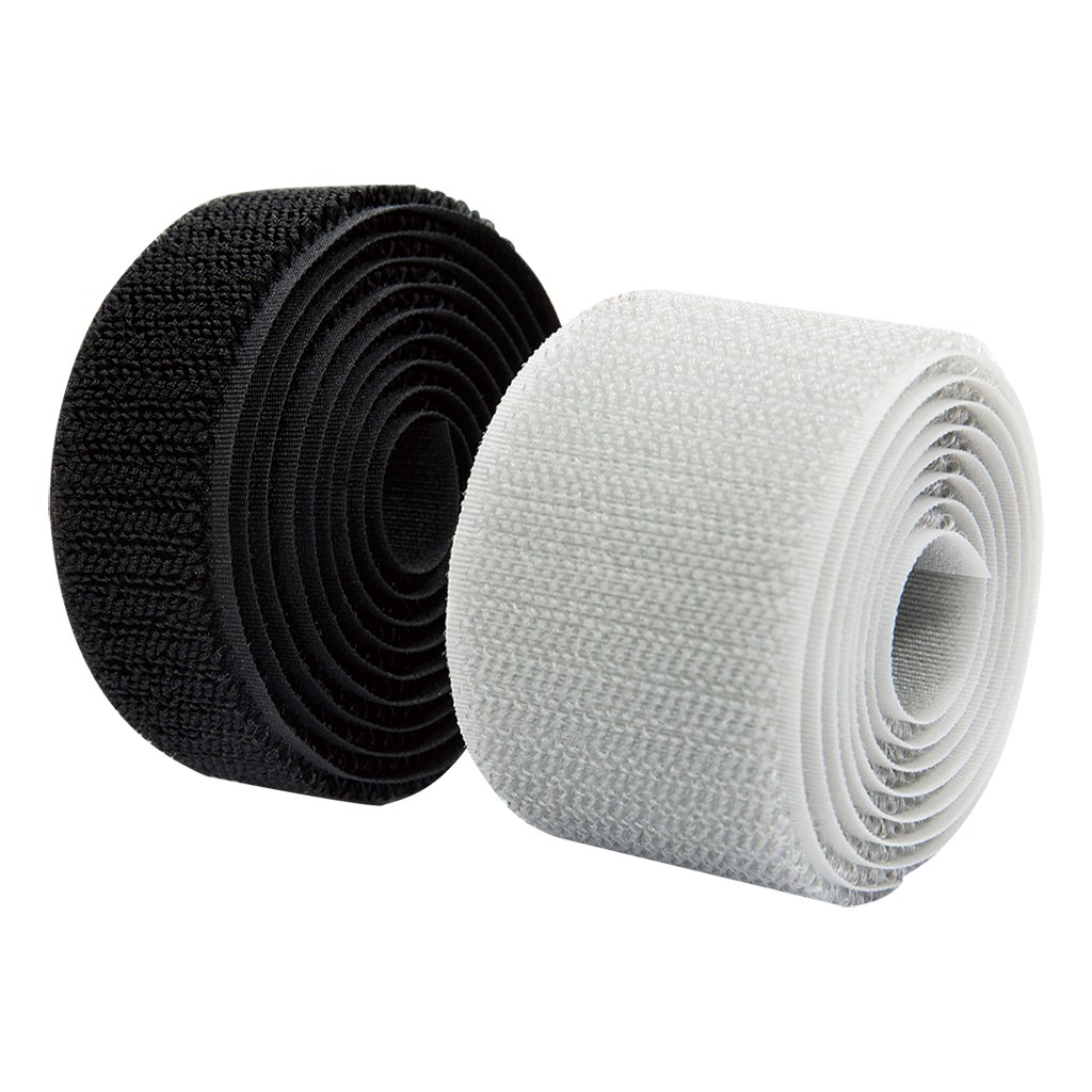Black and white hook and loop tape rolls